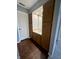 Bathroom with wooden vanity, a sink, and mirror, complemented by vinyl wood flooring at 2967 Eagles Crest Cir # C, Indianapolis, IN 46214