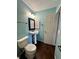 The bathroom features a pedestal sink, a classic mirror, and a ceramic toilet at 2967 Eagles Crest Cir # C, Indianapolis, IN 46214