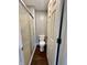 Bathroom with a glass-door shower, toilet, and vanity with wood look flooring at 2967 Eagles Crest Cir # C, Indianapolis, IN 46214