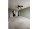 Large bedroom featuring neutral walls, comfortable carpeting, and multiple access points at 2967 Eagles Crest Cir # C, Indianapolis, IN 46214