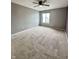 Large bedroom offers ample light and soft carpeting to complete the space at 2967 Eagles Crest Cir # C, Indianapolis, IN 46214