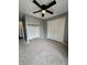 A cozy bedroom features neutral paint, closet storage, and a ceiling fan at 2967 Eagles Crest Cir # C, Indianapolis, IN 46214