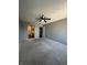 A spacious bedroom with neutral carpet, ceiling fan, and nearby ensuite bathroom at 2967 Eagles Crest Cir # C, Indianapolis, IN 46214