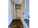 Open closet with hardwood flooring leading into room with fireplace at 2967 Eagles Crest Cir # C, Indianapolis, IN 46214