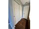 Hallway closet with sliding doors and vinyl flooring at 2967 Eagles Crest Cir # C, Indianapolis, IN 46214