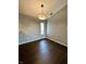 Bright dining room with hardwood floors, natural light, and neutral paint, perfect for entertaining at 2967 Eagles Crest Cir # C, Indianapolis, IN 46214