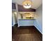 Spacious dining room with hardwood floors, leading into an open kitchen area with ample space at 2967 Eagles Crest Cir # C, Indianapolis, IN 46214