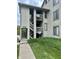 Exterior view of condo with stairway and attractive landscaping surrounding the building at 2967 Eagles Crest Cir # C, Indianapolis, IN 46214