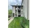 Exterior view of condo with stairway and attractive landscaping surrounding the building at 2967 Eagles Crest Cir # C, Indianapolis, IN 46214