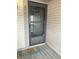 Inviting front door with a storm door and cute, colorful welcome mat enhance curb appeal at 2967 Eagles Crest Cir # C, Indianapolis, IN 46214