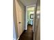 The hallway features hardwood floors with the view to the bathroom at 2967 Eagles Crest Cir # C, Indianapolis, IN 46214