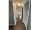 An expansive hallway features hardwood floors with the view to a closet and the front door at 2967 Eagles Crest Cir # C, Indianapolis, IN 46214