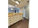 Kitchen boasts white cabinets, wood counters, and modern appliances, seamlessly connected to the dining area at 2967 Eagles Crest Cir # C, Indianapolis, IN 46214