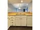 Kitchen includes white cabinets, wood counters, and modern appliances, all connected to an open living space at 2967 Eagles Crest Cir # C, Indianapolis, IN 46214