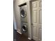 The laundry room has a stacked washer and dryer, maximizing space and convenience at 2967 Eagles Crest Cir # C, Indianapolis, IN 46214