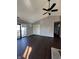 Bright living room with vaulted ceiling, wood-look floors, and access to balcony at 2967 Eagles Crest Cir # C, Indianapolis, IN 46214