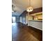 Open floor plan featuring hardwood floors, leading to living room, patio, and adjoined dining room and kitchen at 2967 Eagles Crest Cir # C, Indianapolis, IN 46214