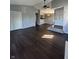 Spacious living room with dark hardwood floors, ceiling fan, and neutral paint throughout at 2967 Eagles Crest Cir # C, Indianapolis, IN 46214