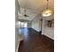 Open concept living room with hardwood flooring, ceiling fan, and lots of natural light at 2967 Eagles Crest Cir # C, Indianapolis, IN 46214