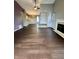 Open concept living room featuring dark wood floors and white trim at 2967 Eagles Crest Cir # C, Indianapolis, IN 46214