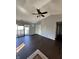 A sunlit living room with ceiling fan, access to balcony, and neutral walls at 2967 Eagles Crest Cir # C, Indianapolis, IN 46214