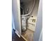 Water heater in a utility space with copper piping and silver ductwork, with some stains on floor at 2967 Eagles Crest Cir # C, Indianapolis, IN 46214