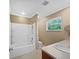 Clean and bright bathroom with a shower-tub combo, fresh white fixtures, and neutral wall color at 3078 Armory Dr, Indianapolis, IN 46208