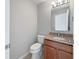 Powder room featuring a granite countertop and neutral wall paint at 3078 Armory Dr, Indianapolis, IN 46208