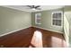 Well-lit bedroom with hardwood floors and large windows for ample natural light at 3078 Armory Dr, Indianapolis, IN 46208