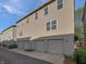 Townhouse complex with convenient attached garages and well-maintained exteriors at 3078 Armory Dr, Indianapolis, IN 46208