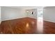 Open living space with gleaming hardwood floors, ample light and easy access to dining area at 3078 Armory Dr, Indianapolis, IN 46208