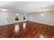 Spacious living room with hardwood floors and natural light streaming through arched windows at 3078 Armory Dr, Indianapolis, IN 46208