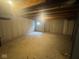 Spacious unfinished basement with exposed ceiling beams, offering potential for storage or renovation at 317 Legacy Blvd, Greenwood, IN 46143