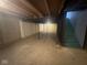 Unfinished basement with exposed ceiling and stairs, offering potential for customization and storage at 317 Legacy Blvd, Greenwood, IN 46143