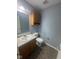 Functional bathroom with a vanity, toilet, cabinet and neutral decor at 317 Legacy Blvd, Greenwood, IN 46143