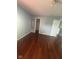 Bedroom with hardwood floors, with a mirror and closet view at 317 Legacy Blvd, Greenwood, IN 46143
