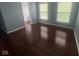 Bedroom with hardwood floors, closet view and two windows at 317 Legacy Blvd, Greenwood, IN 46143