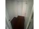 Narrow closet with wire shelf, white walls and wooden floor at 317 Legacy Blvd, Greenwood, IN 46143