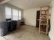 Garage with storage racks, a wooden chair, three windows, and plenty of room for storage at 317 Legacy Blvd, Greenwood, IN 46143