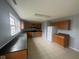 Well-lit kitchen with ample oak cabinets, stainless steel appliances and tile floors at 317 Legacy Blvd, Greenwood, IN 46143