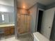 Glass enclosed standup shower features tiled walls, a showerhead, and convenient shelving at 317 Legacy Blvd, Greenwood, IN 46143