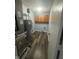 Utility room with a water heater, and cabinets and a dark floor at 317 Legacy Blvd, Greenwood, IN 46143