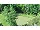 Aerial view of a pond surrounded by dense trees and green space at 3282 S Conservation Club Rd, Morgantown, IN 46160