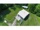 Aerial view of barn featuring a concrete slab with an additional smaller shed on the property at 3282 S Conservation Club Rd, Morgantown, IN 46160