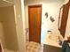 Bathroom featuring a vanity with sink, wood door, and walk in shower at 3282 S Conservation Club Rd, Morgantown, IN 46160
