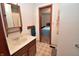 Bathroom featuring a wood vanity and a doorway leading to the bedroom at 3282 S Conservation Club Rd, Morgantown, IN 46160