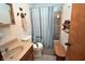 Bright bathroom with walk-in shower, safety bars, linen closet, and vanity sink at 3282 S Conservation Club Rd, Morgantown, IN 46160