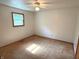 Bedroom with neutral walls, a window for natural light, and wall to wall carpet at 3282 S Conservation Club Rd, Morgantown, IN 46160