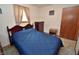 Inviting bedroom with a cozy bed, side table, and a well-lit window at 3282 S Conservation Club Rd, Morgantown, IN 46160