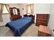Bedroom featuring a comfortable bed, windows for natural light, and wooden furniture at 3282 S Conservation Club Rd, Morgantown, IN 46160